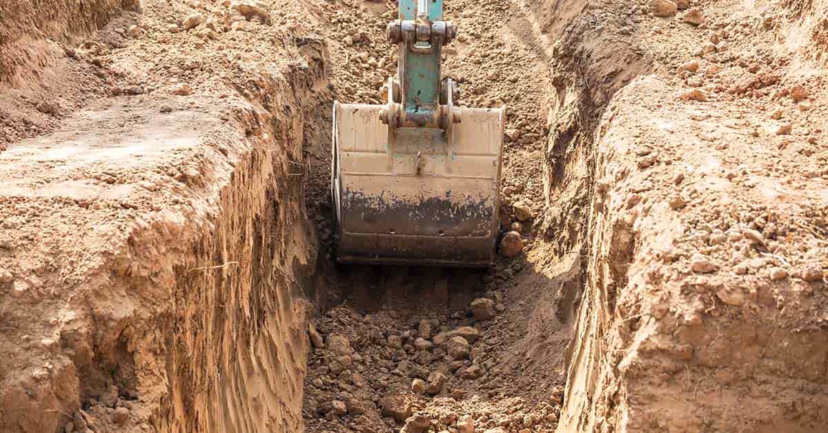 excavator digging trenches